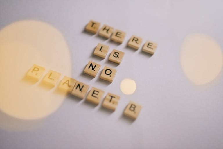 Scrabble Tiles Forming a Save Earth Message