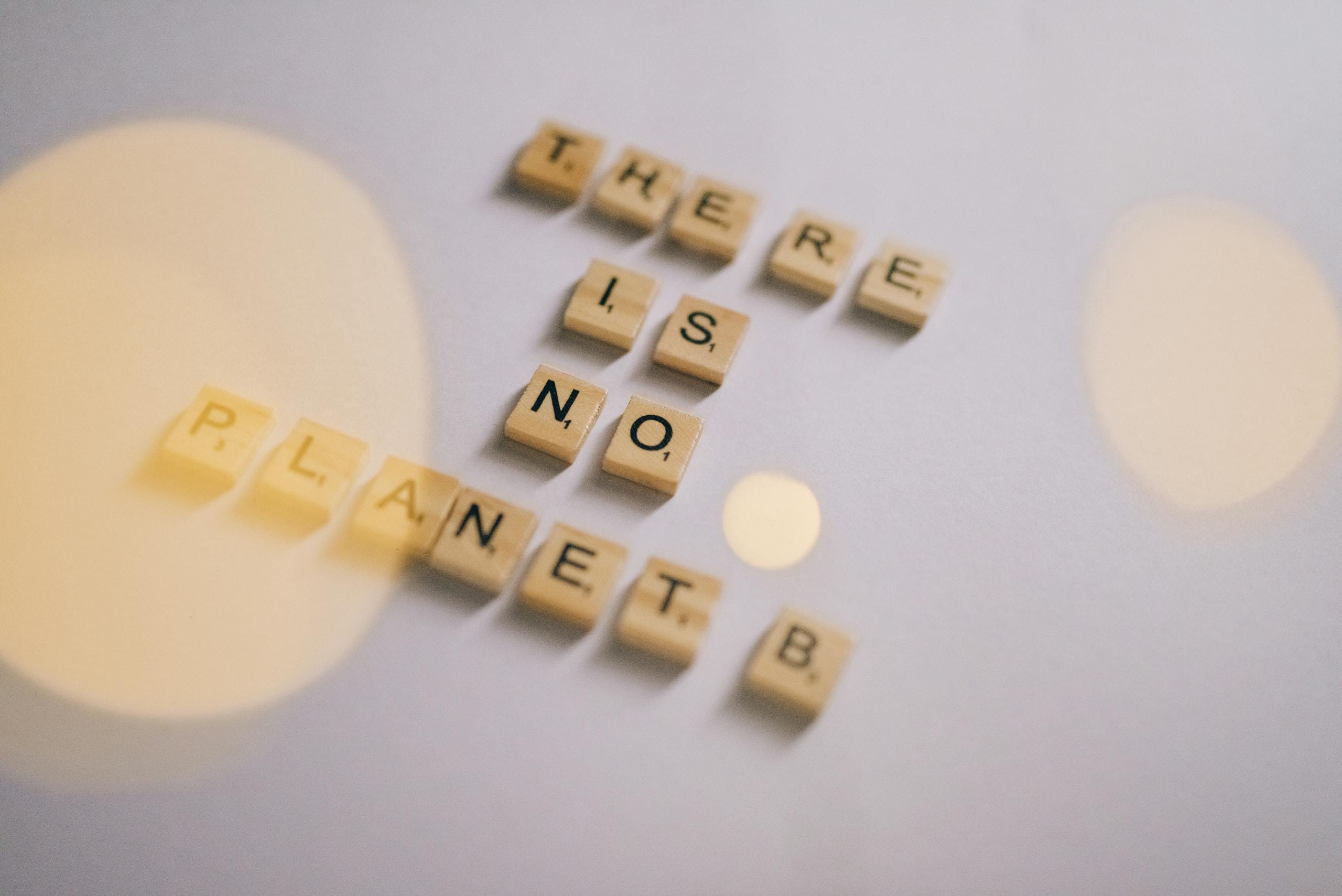 Scrabble Tiles Forming a Save Earth Message
